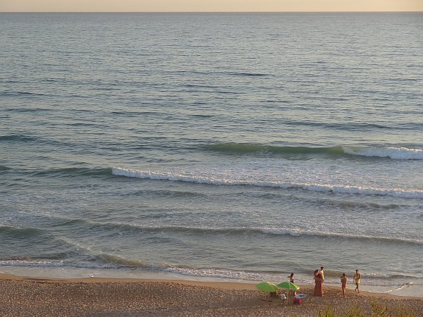 Family at La Barrosa beach shortly before sunset