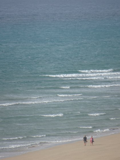 Early morning walkers at Costa Calma beach