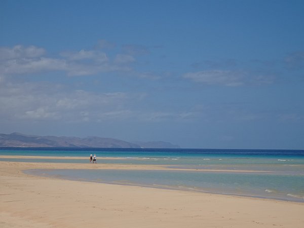 Couple walking at Sotavento lagoon