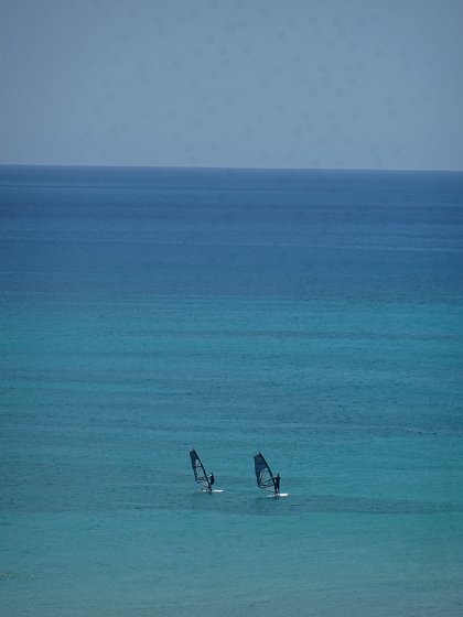 Two windsurfers at Costa Calma beach