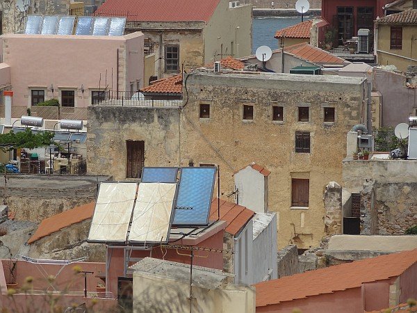 Solar panels and satellite dishes on roof