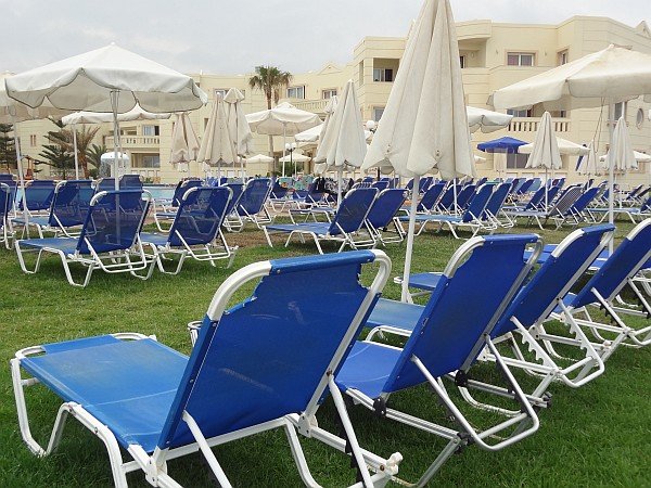 Empty sun loungers at Maleme hotel