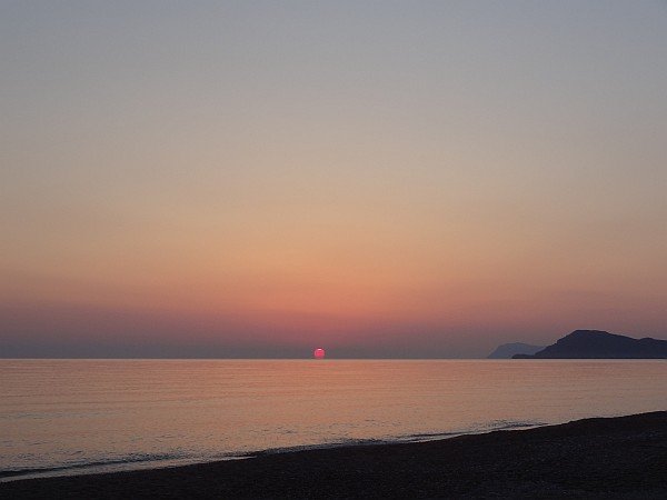 Sun rising near Agioi Theodoroi island