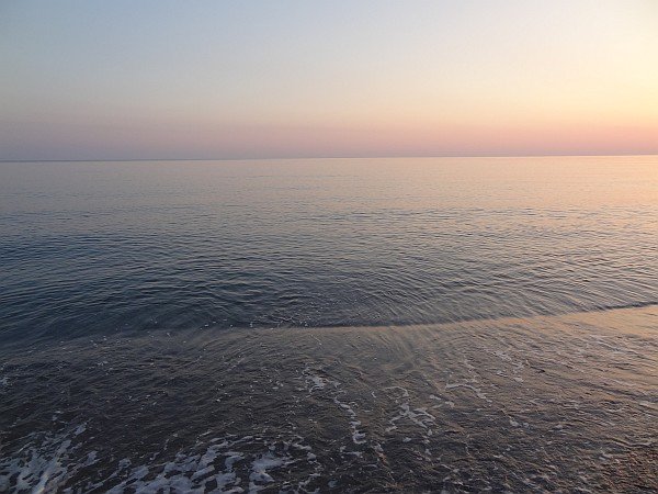 Beach, sea and sky at sunrise