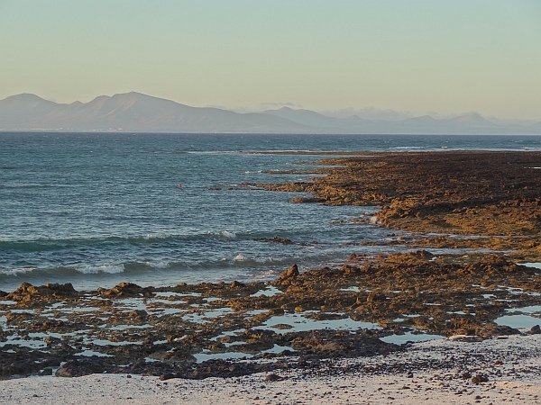 Beach near Corralejo harbour at sunset (in background Lanzarote)