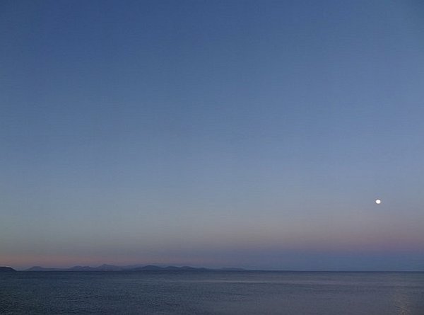 Flamingo beach at dawn with full moon