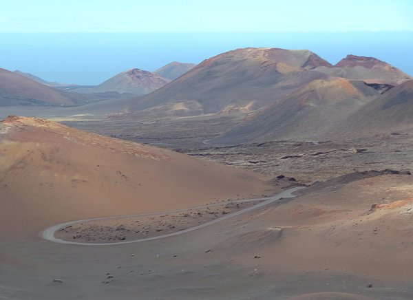 Volcanic landscape with road in Timanfaya park