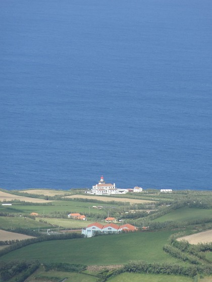 Lighthouse at coast near Ponta da Ferraria seen from Sete Cidades crater rim