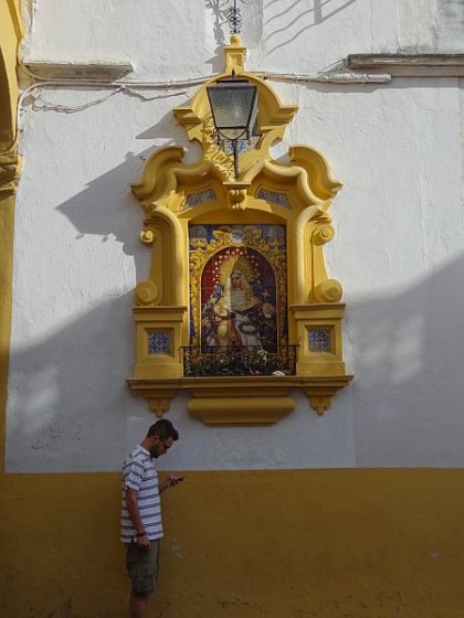 Virgin Mary ceramic panel with passer-by in Arenal neighbourhood